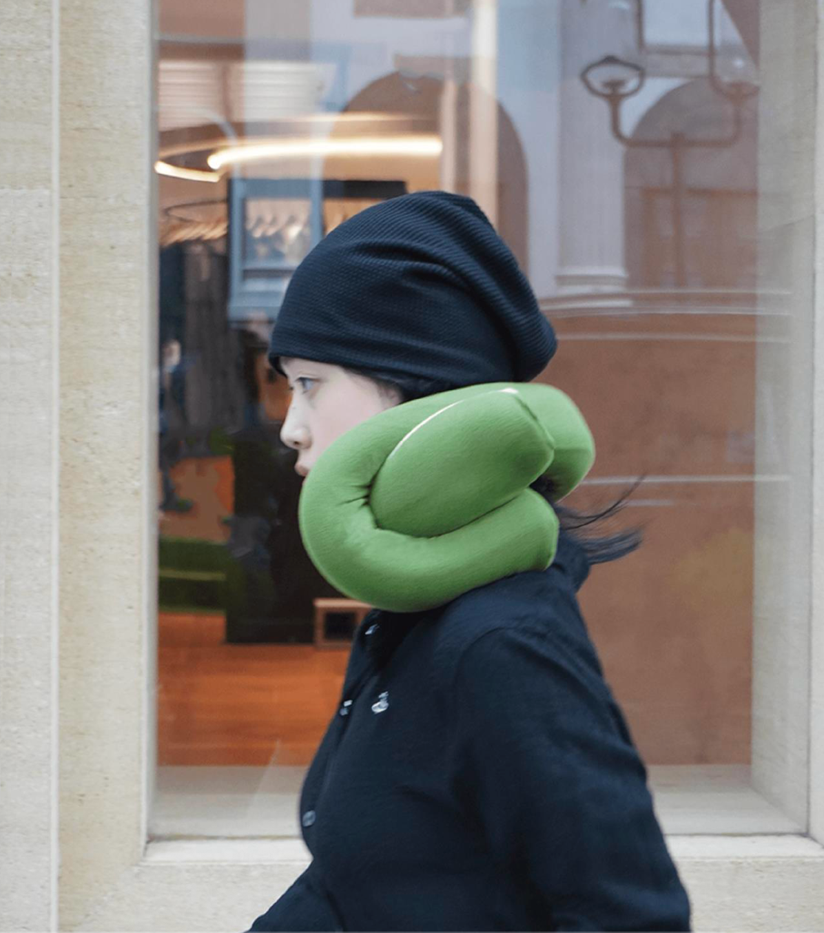 On the move in the city, wearing the pillow
